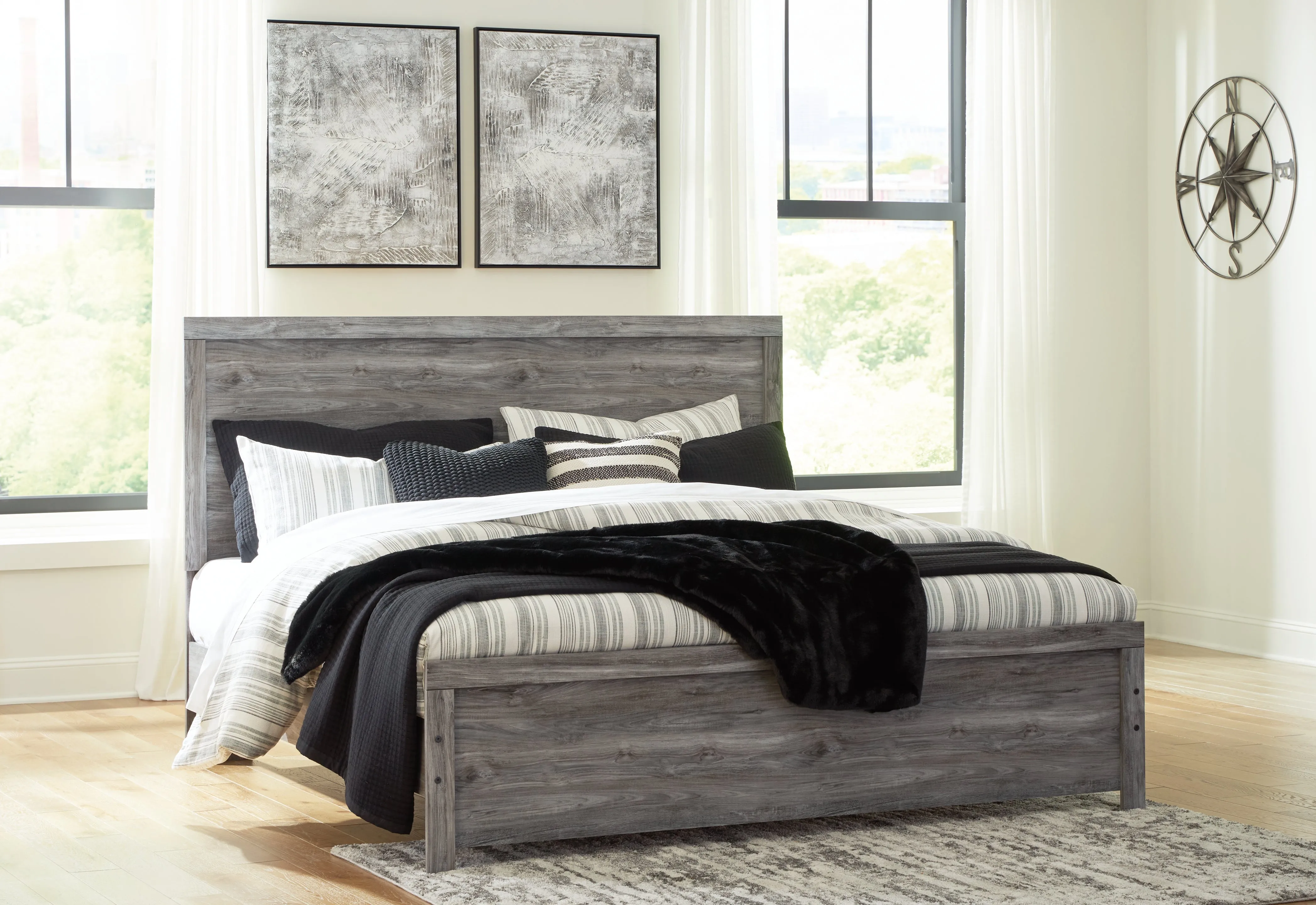 Bronyan King Panel Bed with Mirrored Dresser and Chest in Dark Gray
