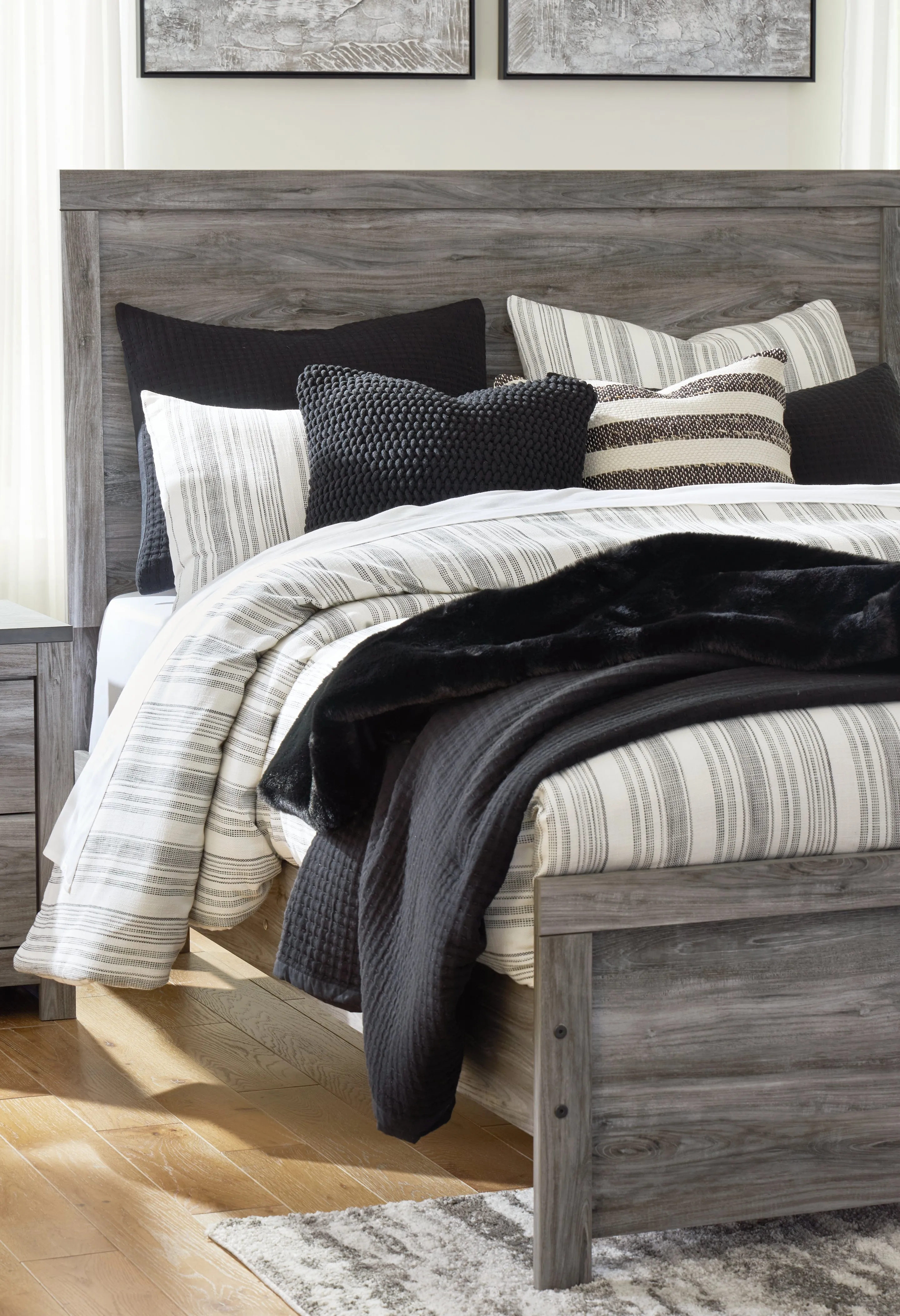 Bronyan King Panel Bed with Mirrored Dresser and Chest in Dark Gray