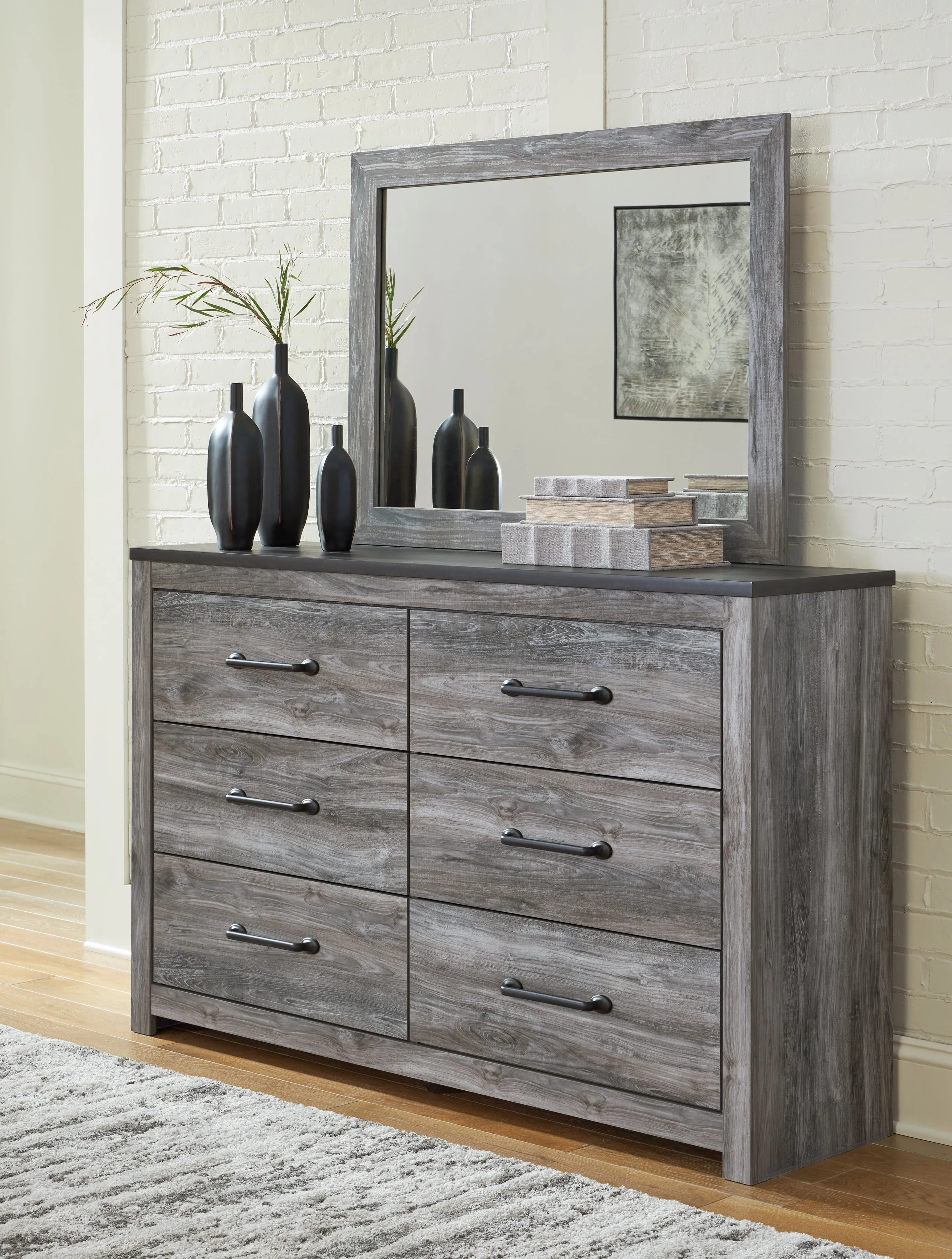 Bronyan King Panel Bed with Mirrored Dresser and Chest in Dark Gray